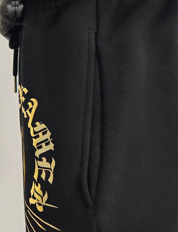 Pantaloni con design in strass e stampa in oro